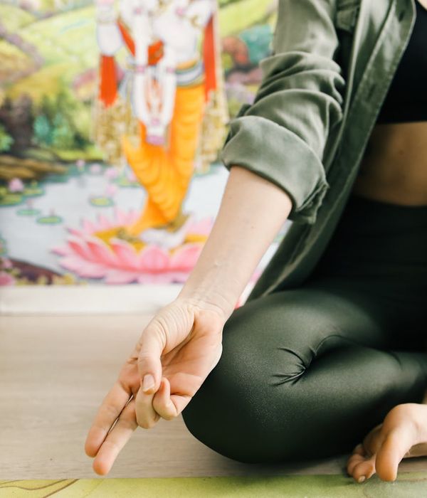 Woman in a calm yoga pose, embodying inner balance and tranquility.